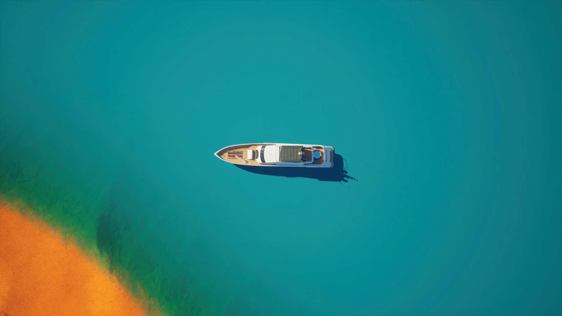 Birds eye view of a luxury yacht on blue water