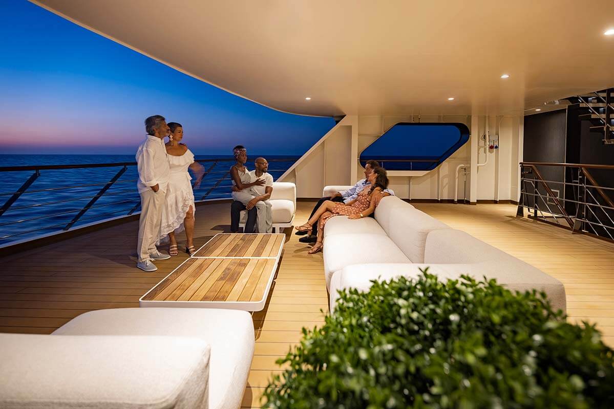 Atlas Ocean Voyages World Navigator al fresco lounge at dusk