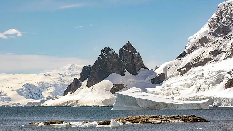 Snowy mountain peaks in an Antarctic harbor