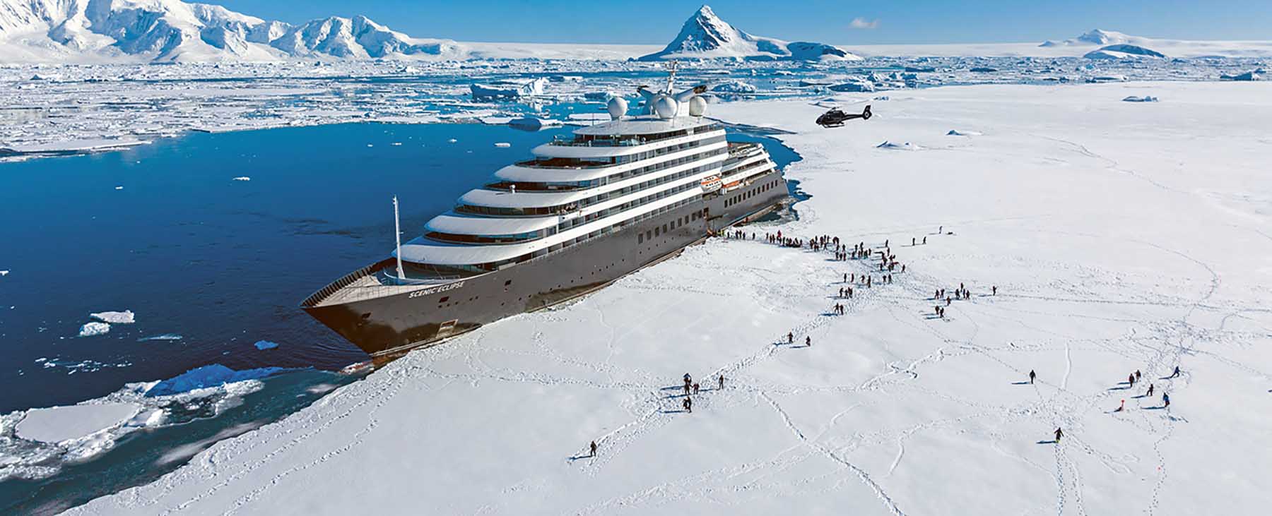 Scenic Eclipse expedition ship moored alongside an Antarctic ice shelf