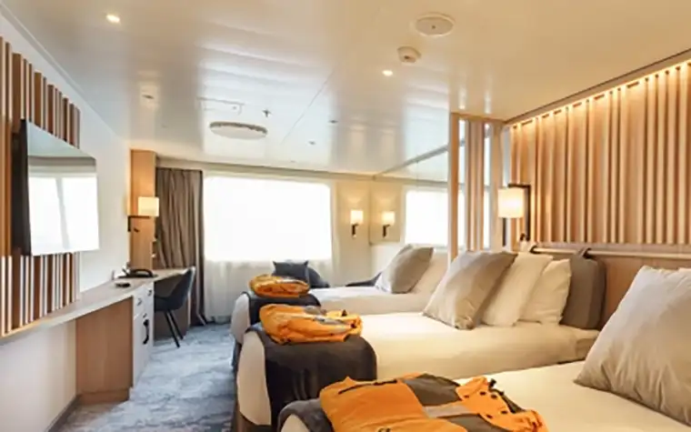 Quark Ultramarine Explorer Triple shared cabin interior with three single berths