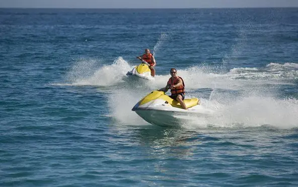 Jet ski excursion skimming across the lagoons of French Polynesia