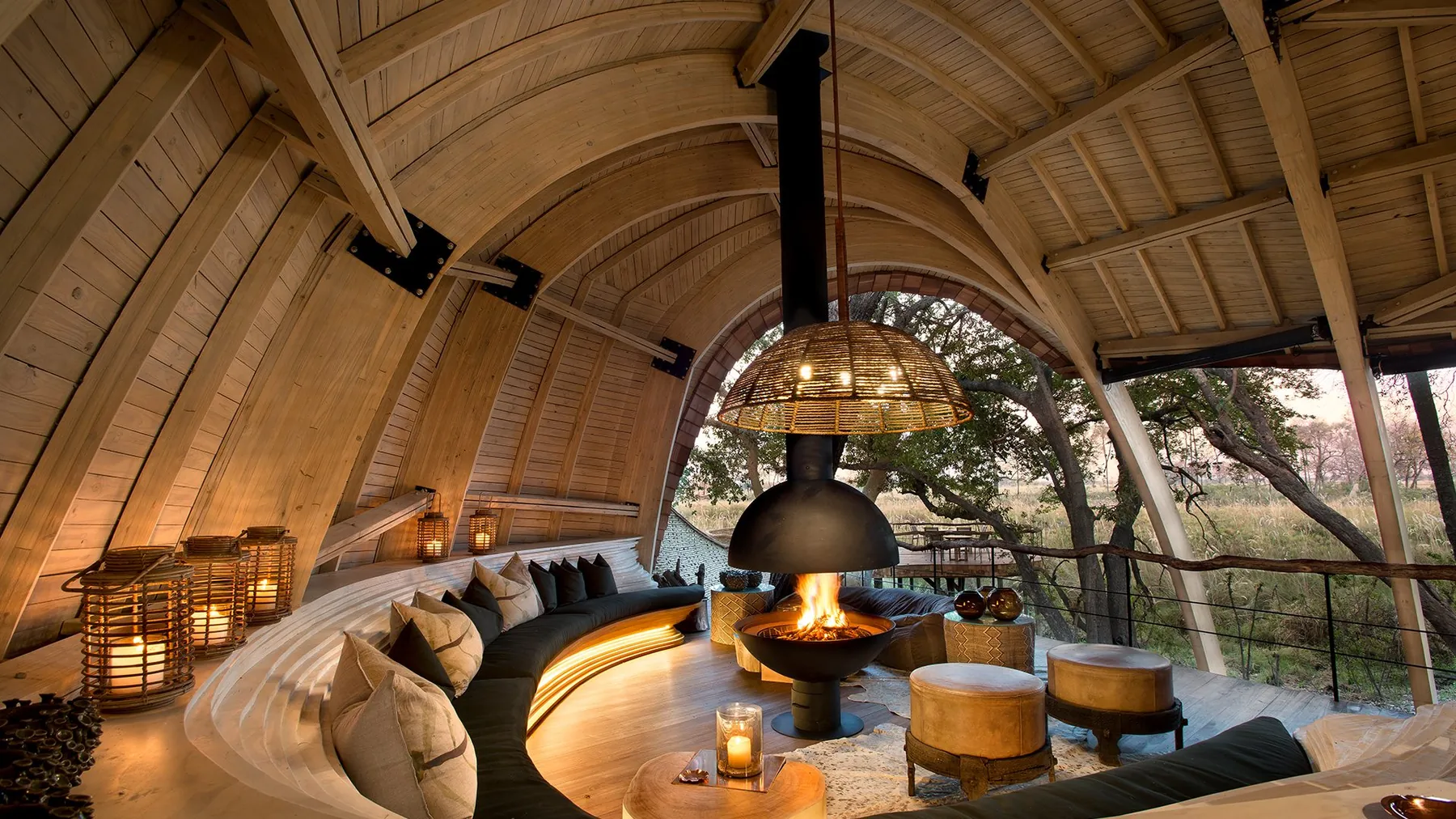 An indoor/outdoor hut with fireplace