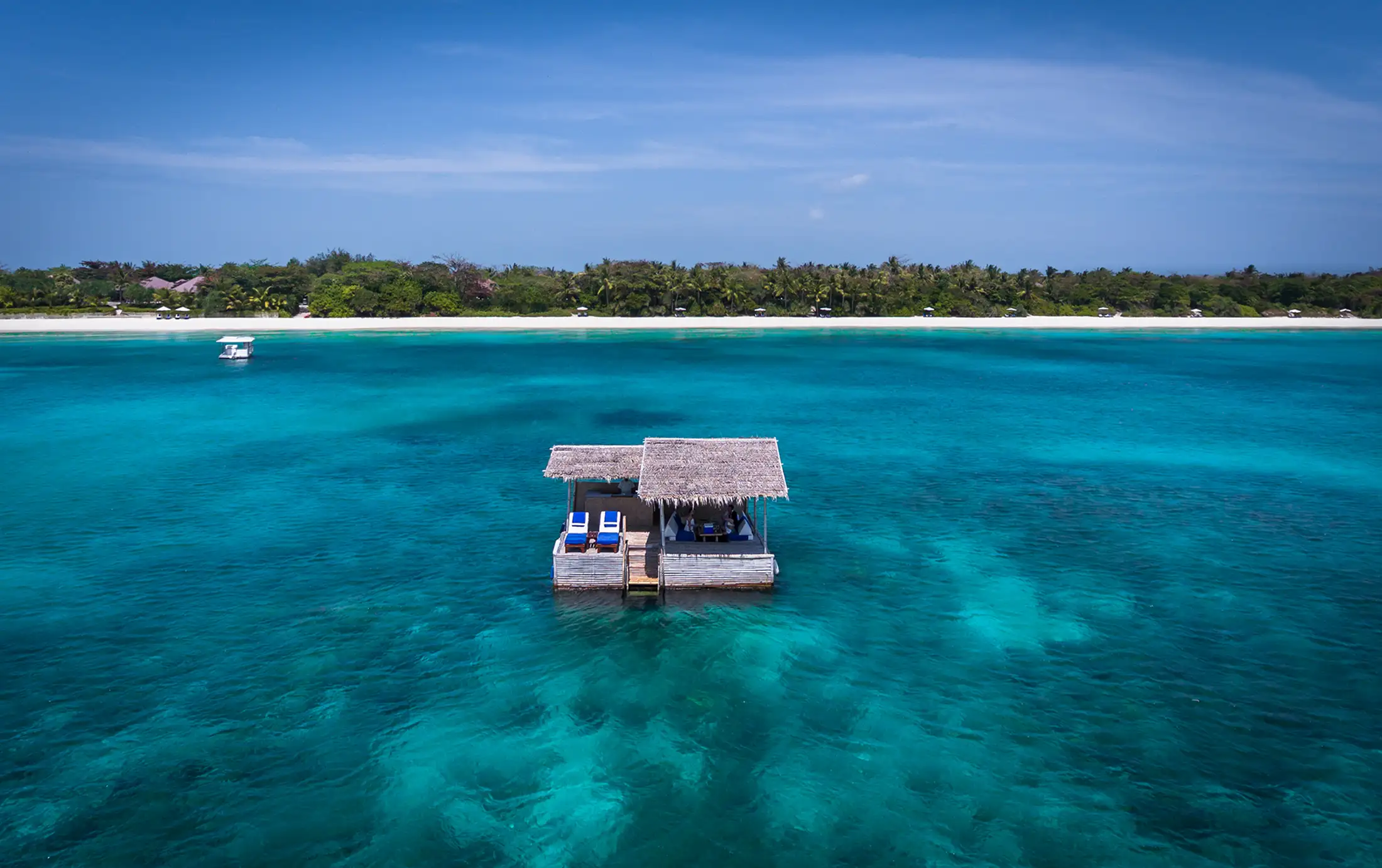 Aerial view of a floating hut Amanpulo island in the Philippines