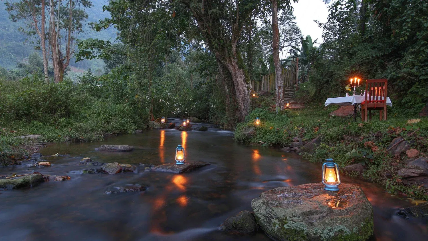 A riverfront safari lodge with candlelight