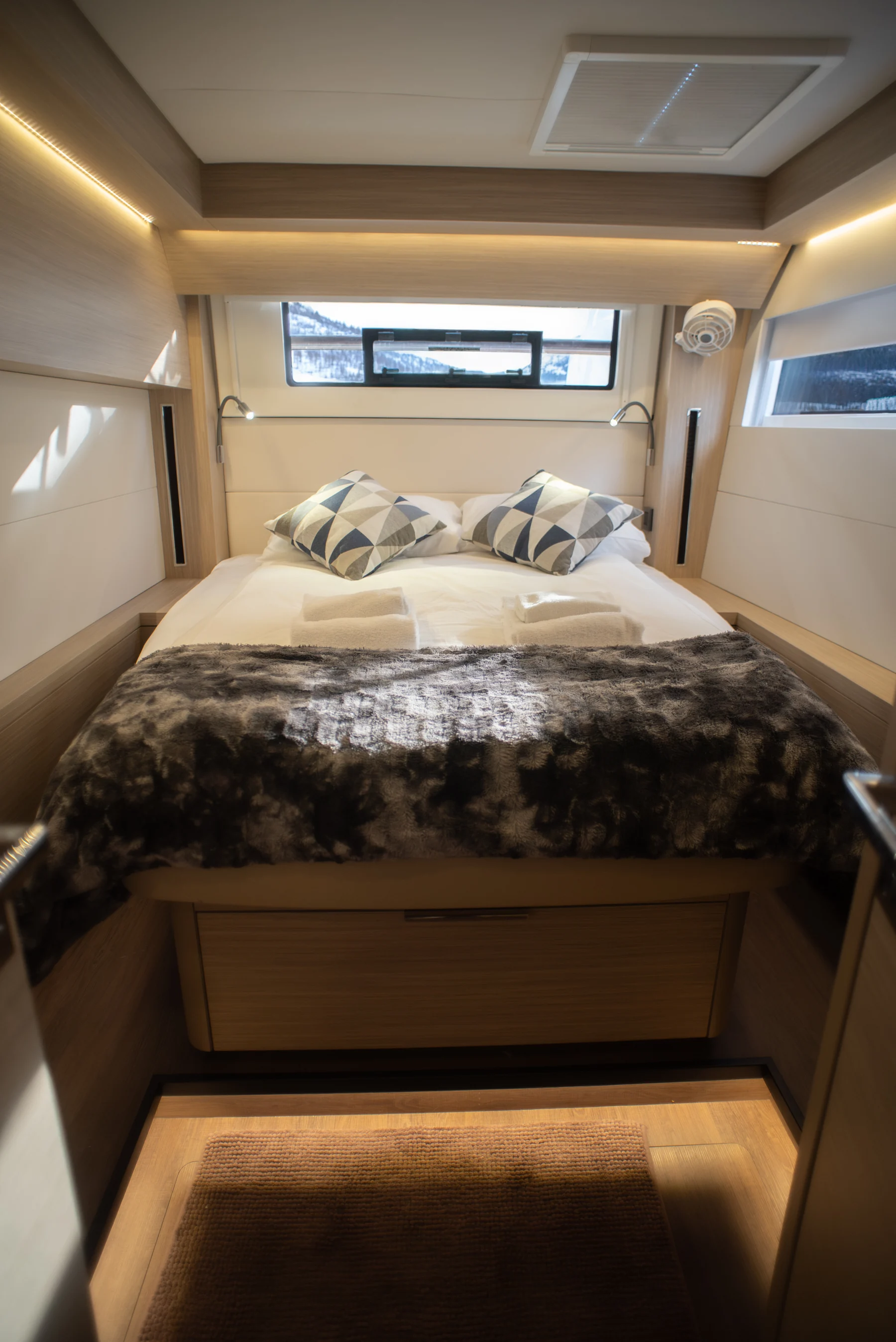 Queen guest cabin aboard the Arctic Dream expedition catamaran