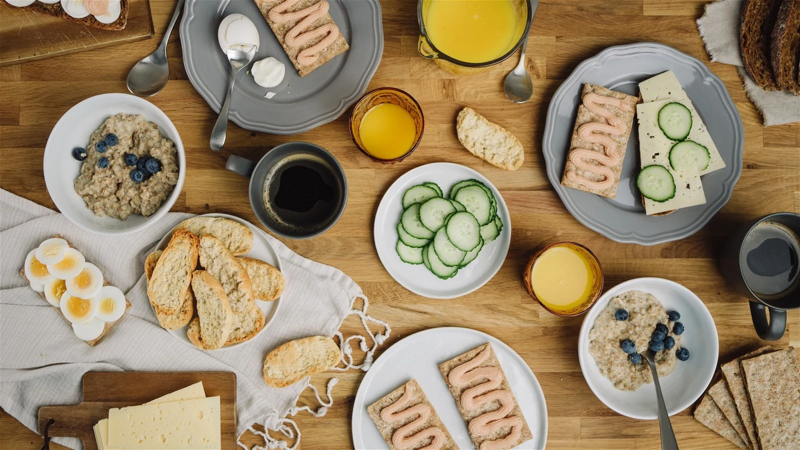 Nordic breakfast spread of bread, cheese, and fruit aboard the yacht