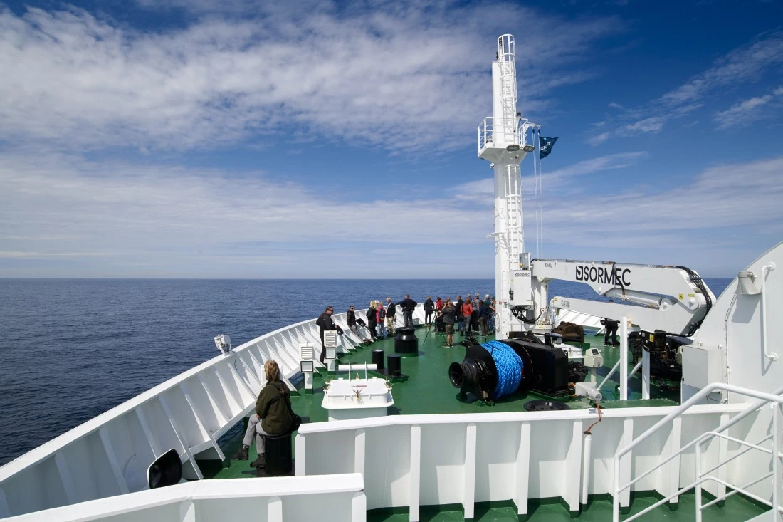 Guests on the bow deck of MV Hondius
