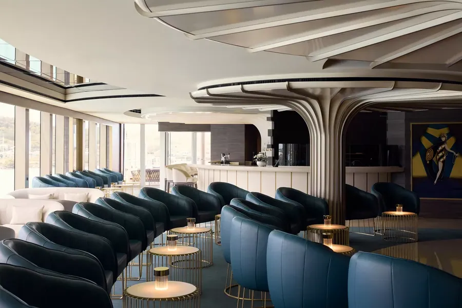 Astern Lounge on deck 5 aboard Explora III, an aft-facing lounge with ocean views