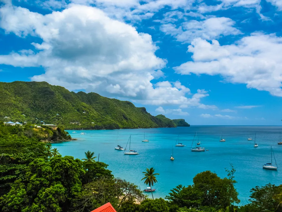 Bequia in Saint Vincent and the Grenadines, with sailboats anchored off the shoreline