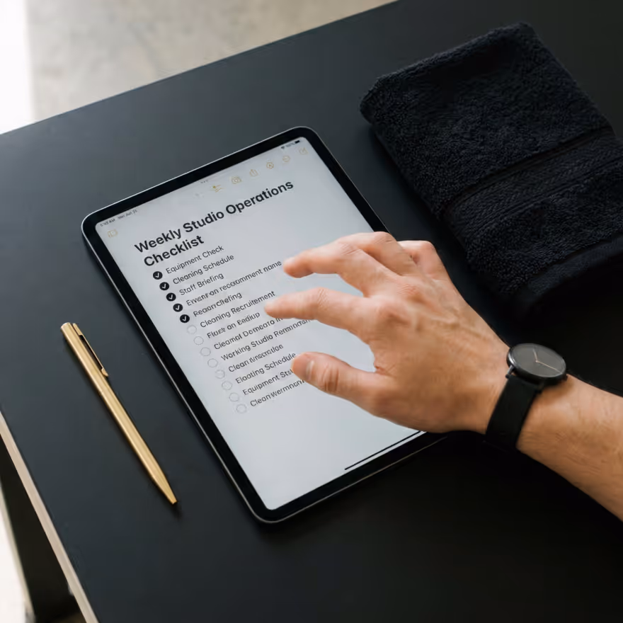 Reviewing gym growth strategy on tablet