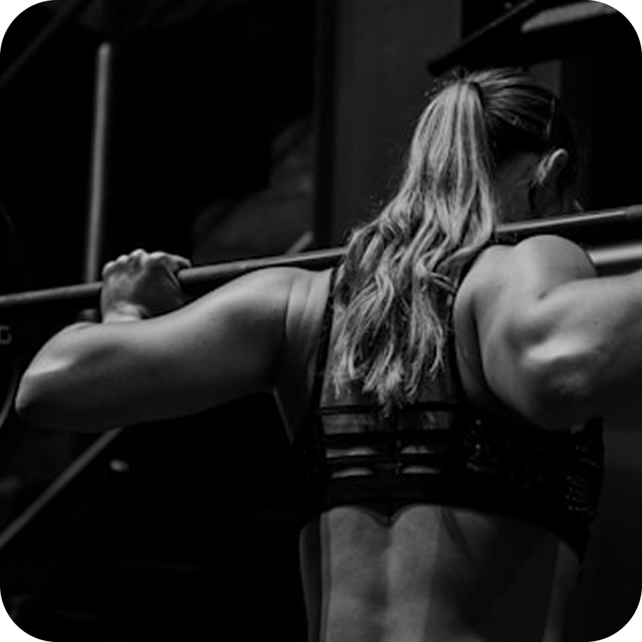 Woman lifting weights during strength training session