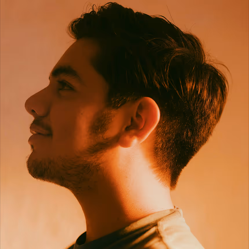 Profile image of a man in orange lighting