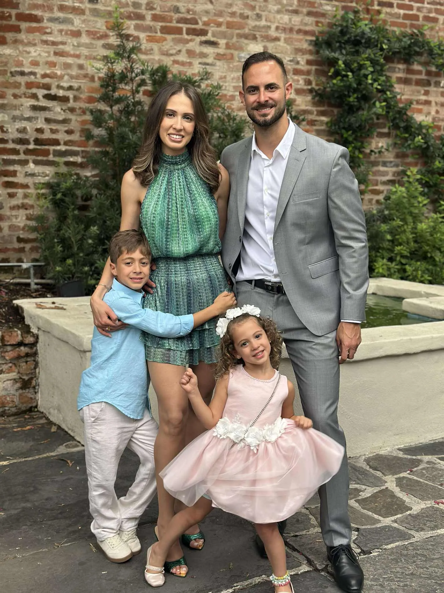 Dr. Rafik Dib family of four posing outdoors at AVA Dental