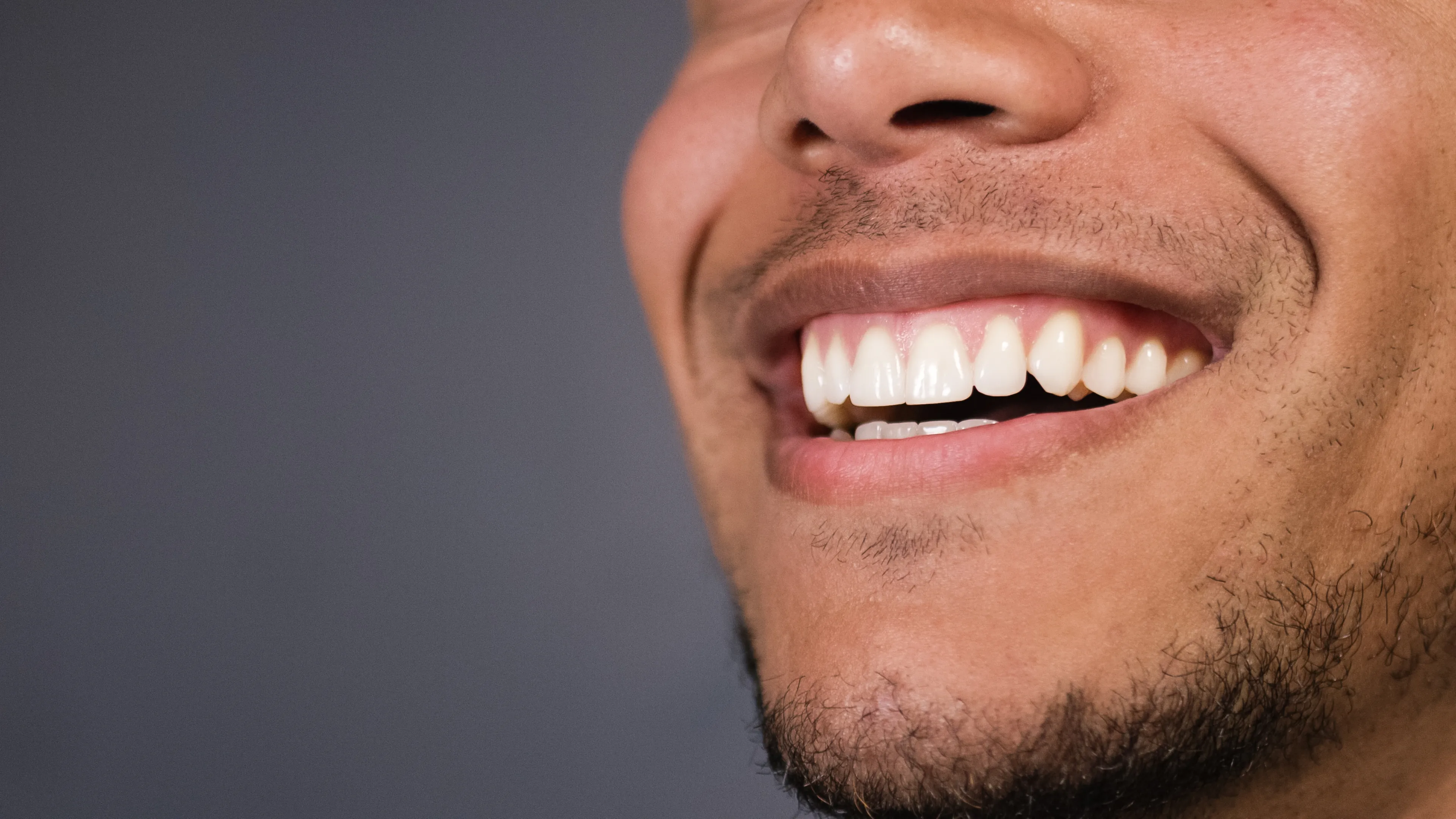 Close-up of a healthy adult smile showcasing natural teeth at Ava Dental.