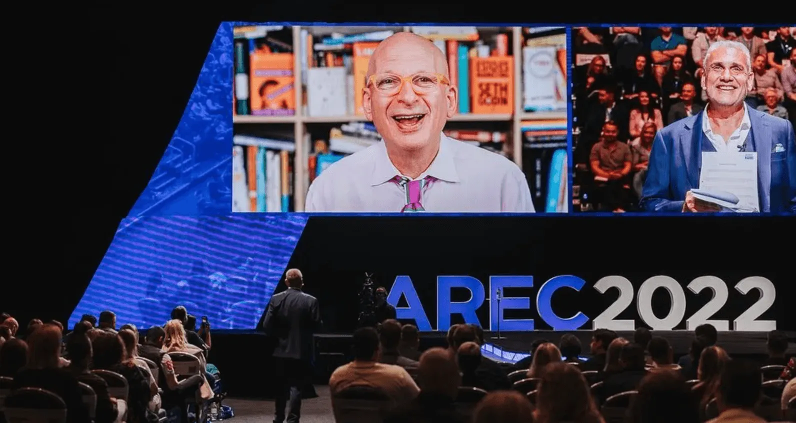 Seth Godin speaking at the AREC 2022 conference.