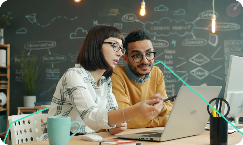 team in front of computer