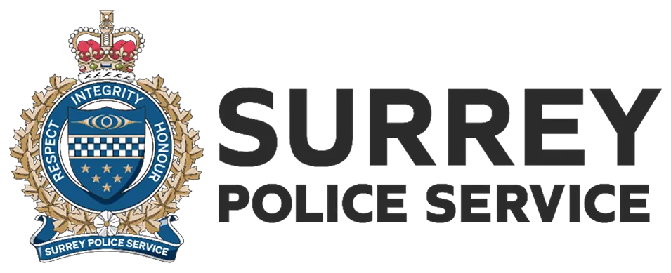 Surrey Police Service emblem featuring a crown, blue circular shield with integrity, respect, honour text, and a banner reading Surrey Police Service.