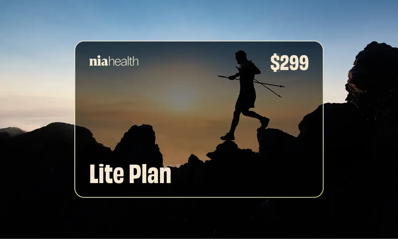 Silhouette of a person hiking with trekking poles over rocky terrain at sunset with text 'niahealth Lite Plan $299'.