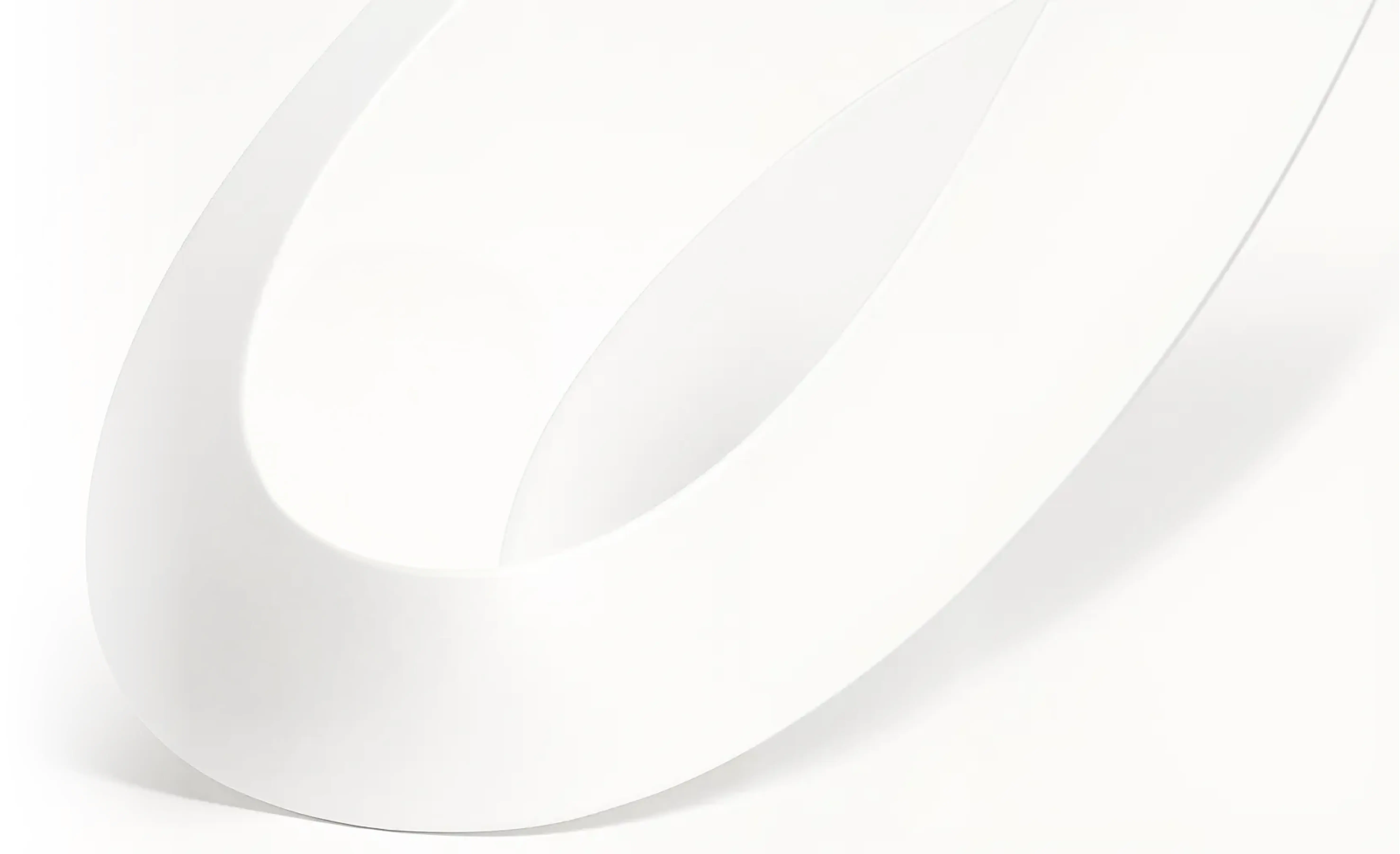 Close-up of smooth, curved white overlapping shapes with soft shadows on a white background.