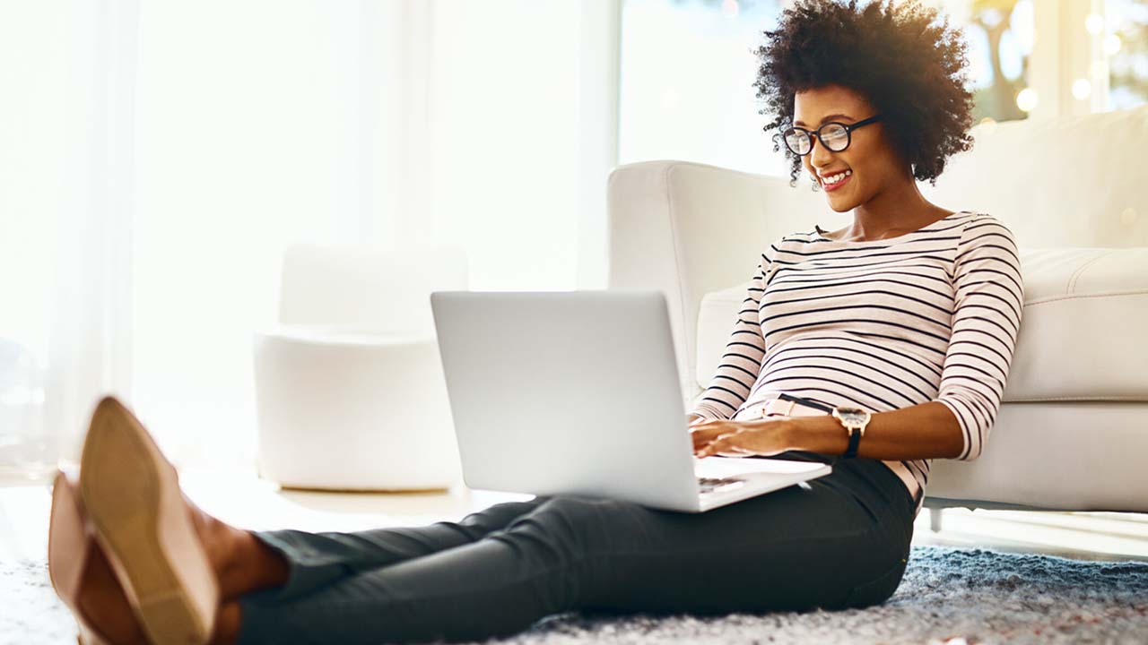 woman sitting on the floor - Are Day Trading Courses Worth It