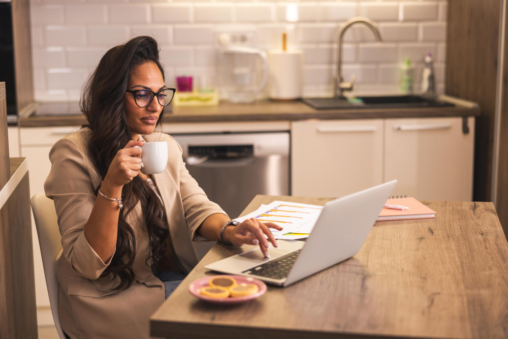 woman on a laptop - Cheapest Prop Firm Challenge