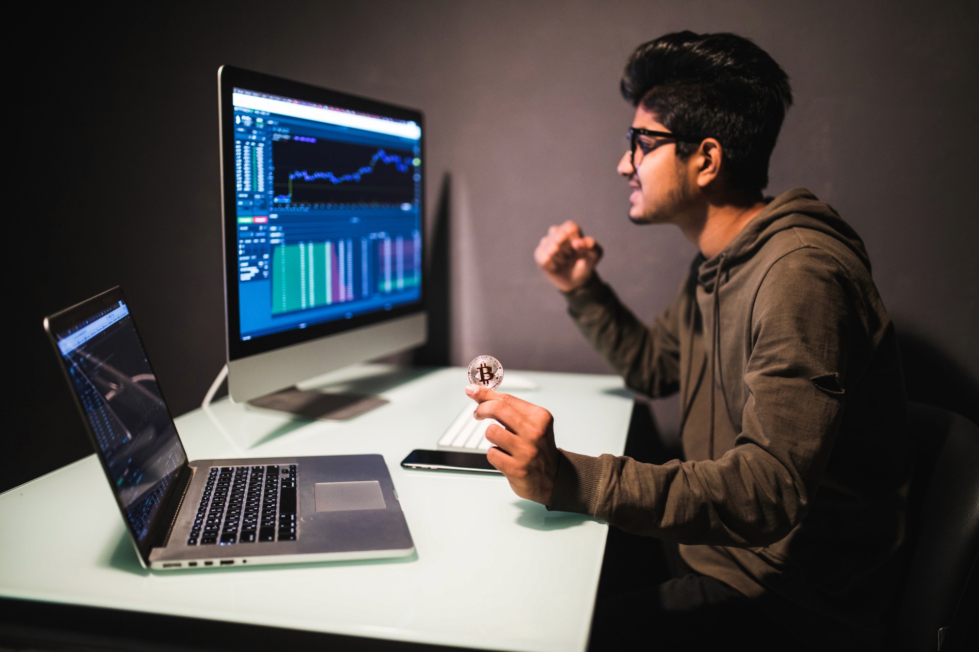 student wearing glasses and trading - Practice Crypto Trading With Fake Money