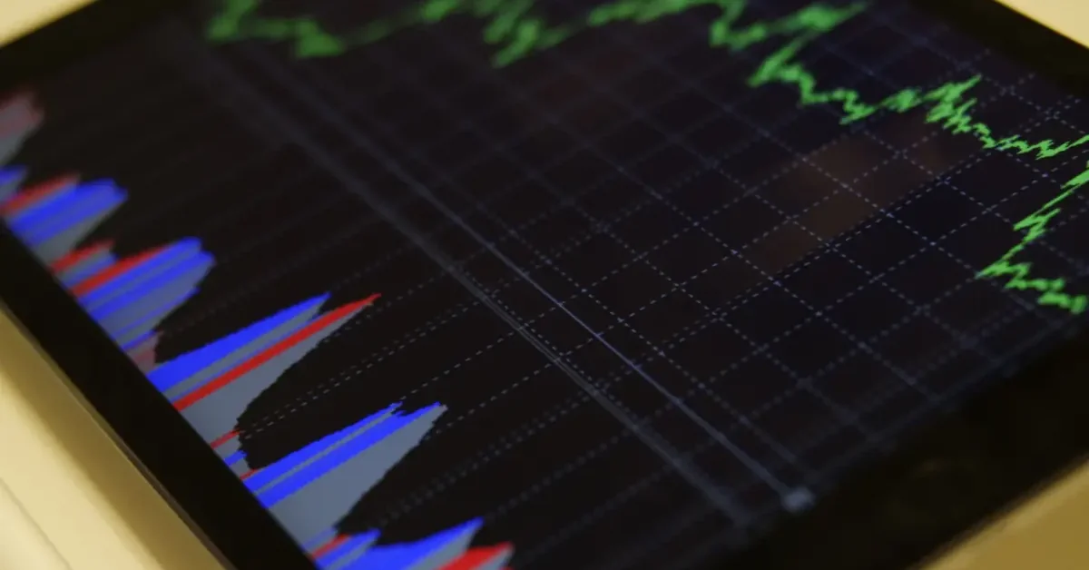 Tablet displaying green and blue stock chart with grid pattern — how to use Webull paper trading