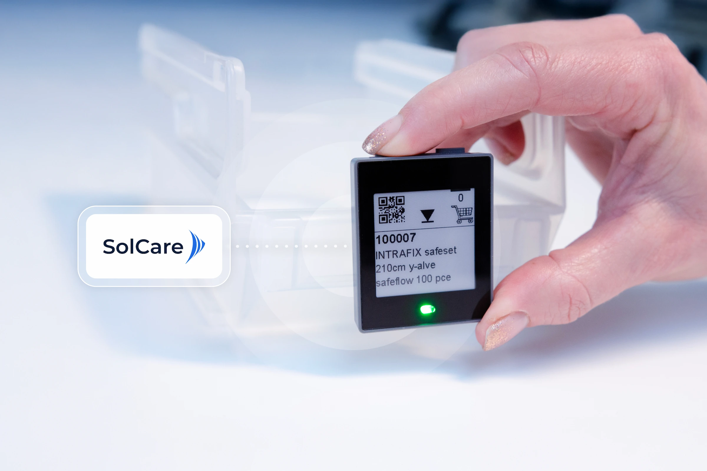 Hand pressing a button on an electronic label connected to the SolCare logo