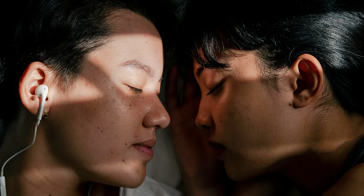 Two people resting quietly with eyes closed