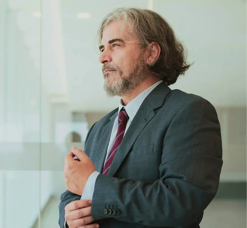 Man standing outdoors with eyes closed