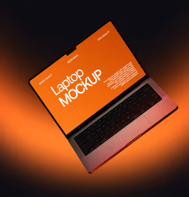 Open laptop tilted with an orange screen displaying the text 'Laptop MOCKUP' and a black keyboard on a dark to orange gradient background.
