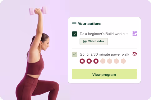 Woman in maroon workout clothes doing a squat while lifting a pink dumbbell above her head next to a fitness app interface showing a beginner build workout and a 30-minute power walk.