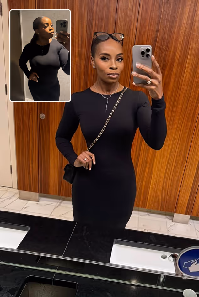 Woman wearing a fitted black dress taking a mirror selfie in a restroom, wearing glasses on her head and a chain purse with another, smaller image of her in a larger body.