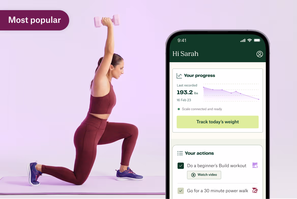 Woman in maroon workout clothes lunging with a pink dumbbell overhead next to a phone showing a fitness app tracking weight and workout progress.