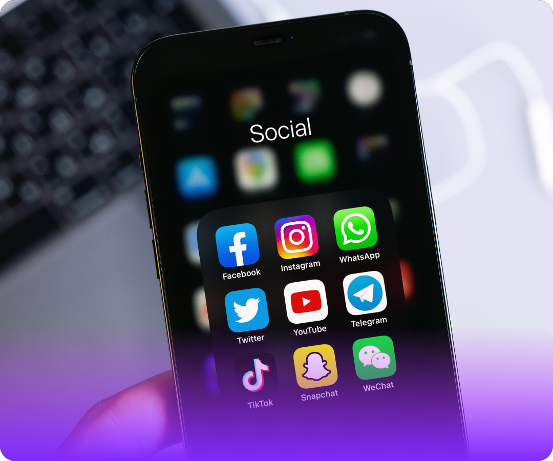 Smartphone screen showing a folder labeled Social with apps: Facebook, Instagram, WhatsApp, Twitter, YouTube, Telegram, TikTok, Snapchat, and WeChat.