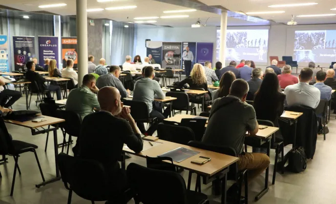 Audience attending cybersecurity conference session