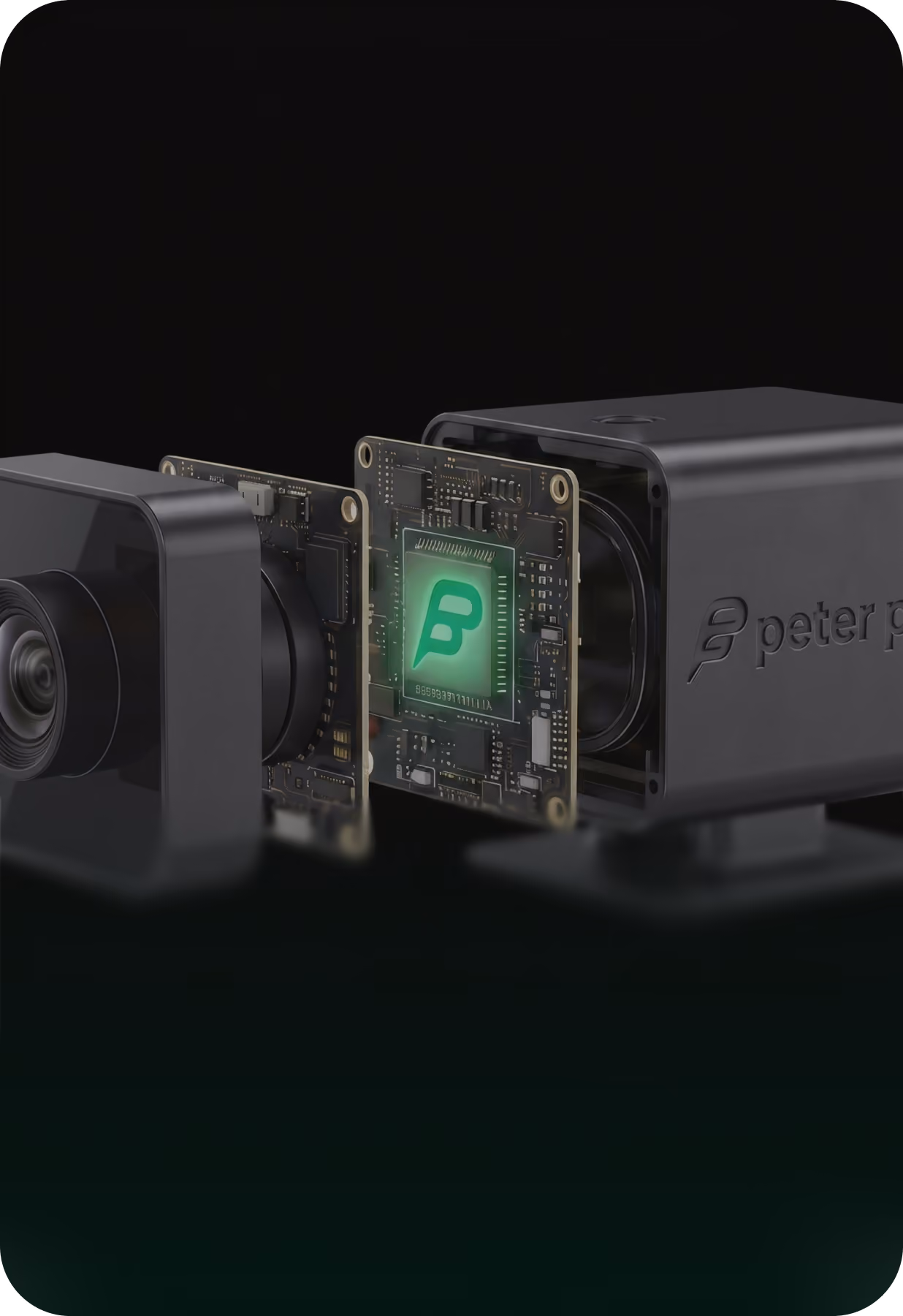 Explodierte Ansicht einer schwarzen Kamera zeigt Linse, Platinen und grünen B-Chip.