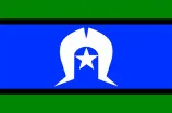 The flag of the Torres Strait Islander people, featuring a blue field with green borders and a white dancer's headdress in the center, over a white star.