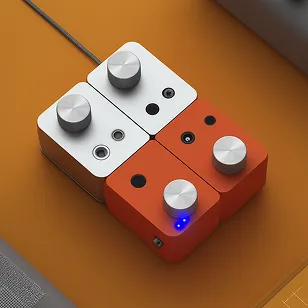 Four compact audio effect pedals in white and orange arranged in a square with knobs and input/output jacks on a brown surface.