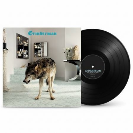 Schallplatte und Albumcover mit einem Wolf von Grinderman in einem modernen Raum mit Spiegeln und Skulpturen.