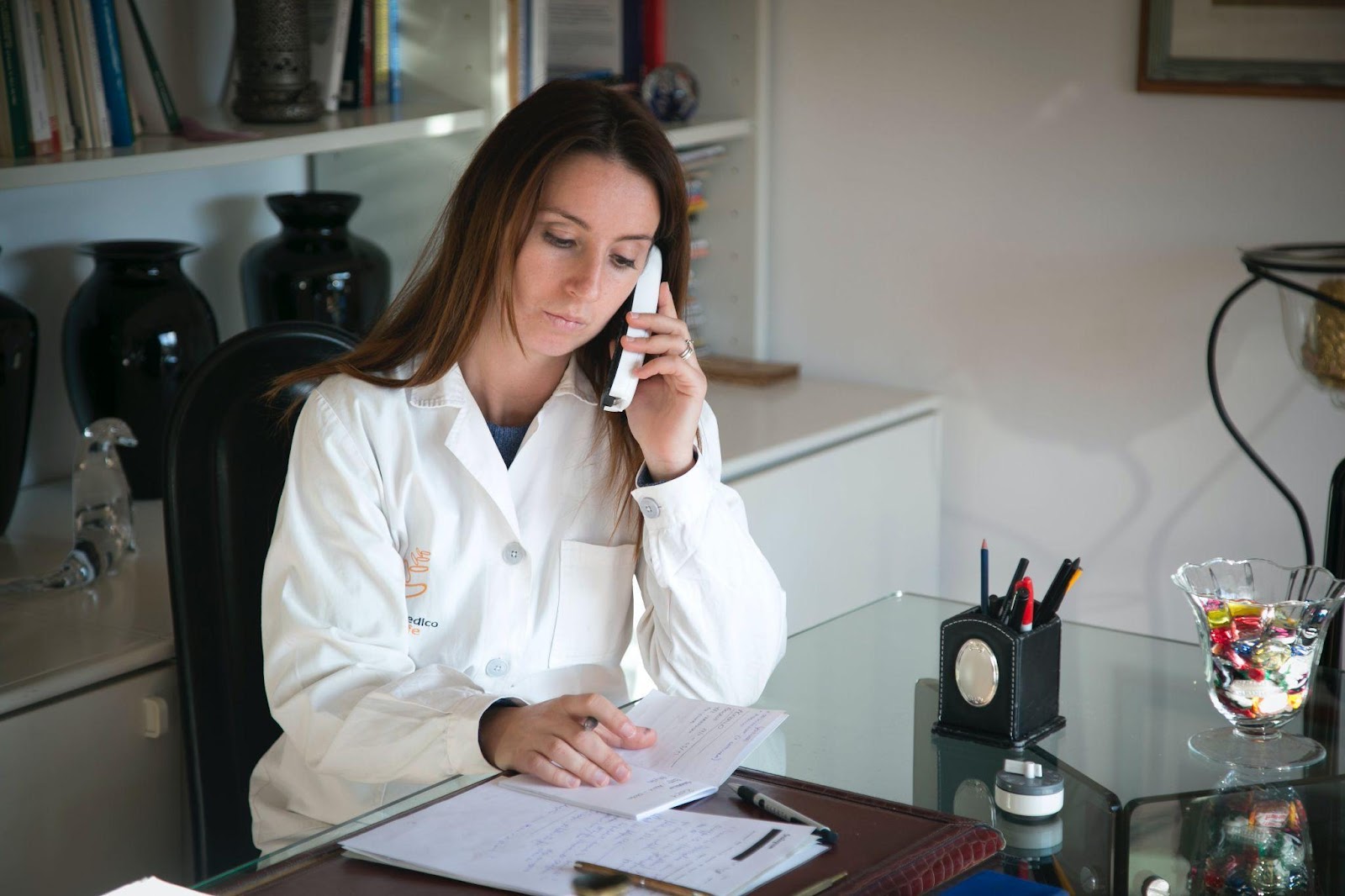 a medical professional using a phone