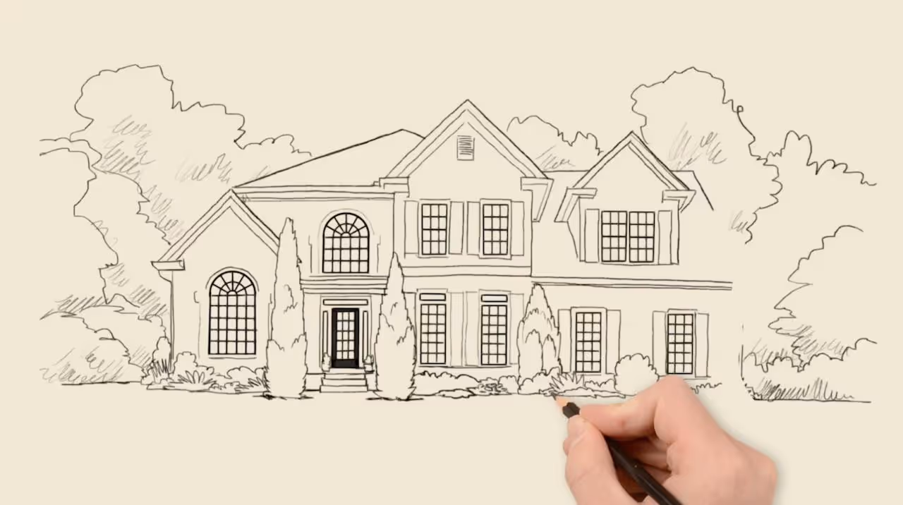 Hand drawing a detailed sketch of a two-story house with multiple windows, shutters, front door, and surrounding trees and bushes.