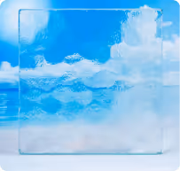 Clear textured glass panel with a pattern of wavy horizontal lines against a blue sky with clouds.
