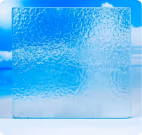 Translucent textured glass square with a blue sky and clouds in the background.