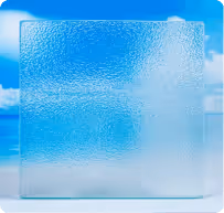 Square textured glass panel with a frosted appearance against a blue sky background.