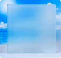 Frosted square glass panel with a blurred beach background of blue sky and ocean.