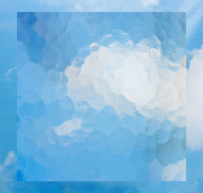 Translucent square glass panel with a wavy textured surface against a blue sky with clouds background.