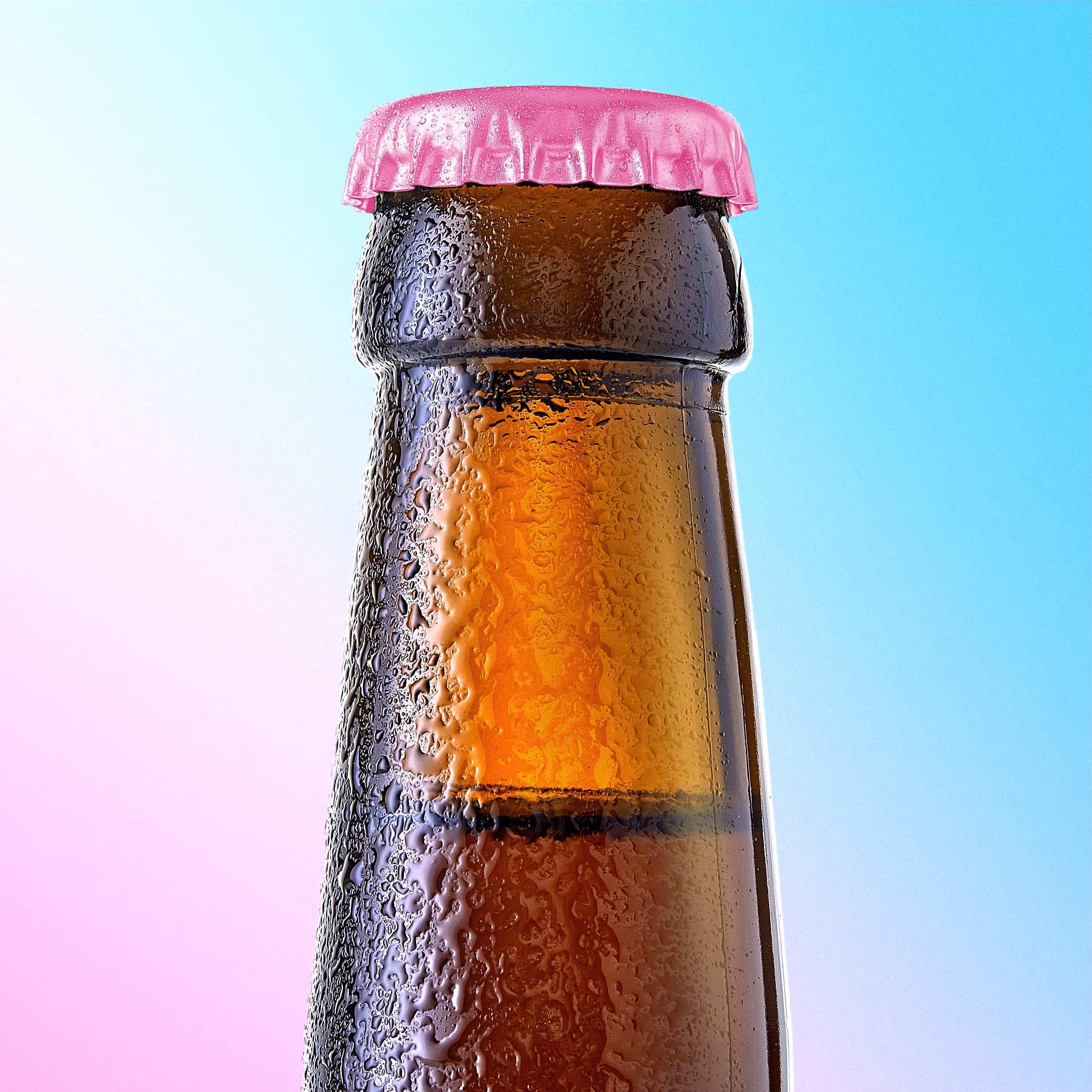 Close-up of a cold brown beer bottle neck with condensation and a pink bottle cap against a gradient blue and pink background.