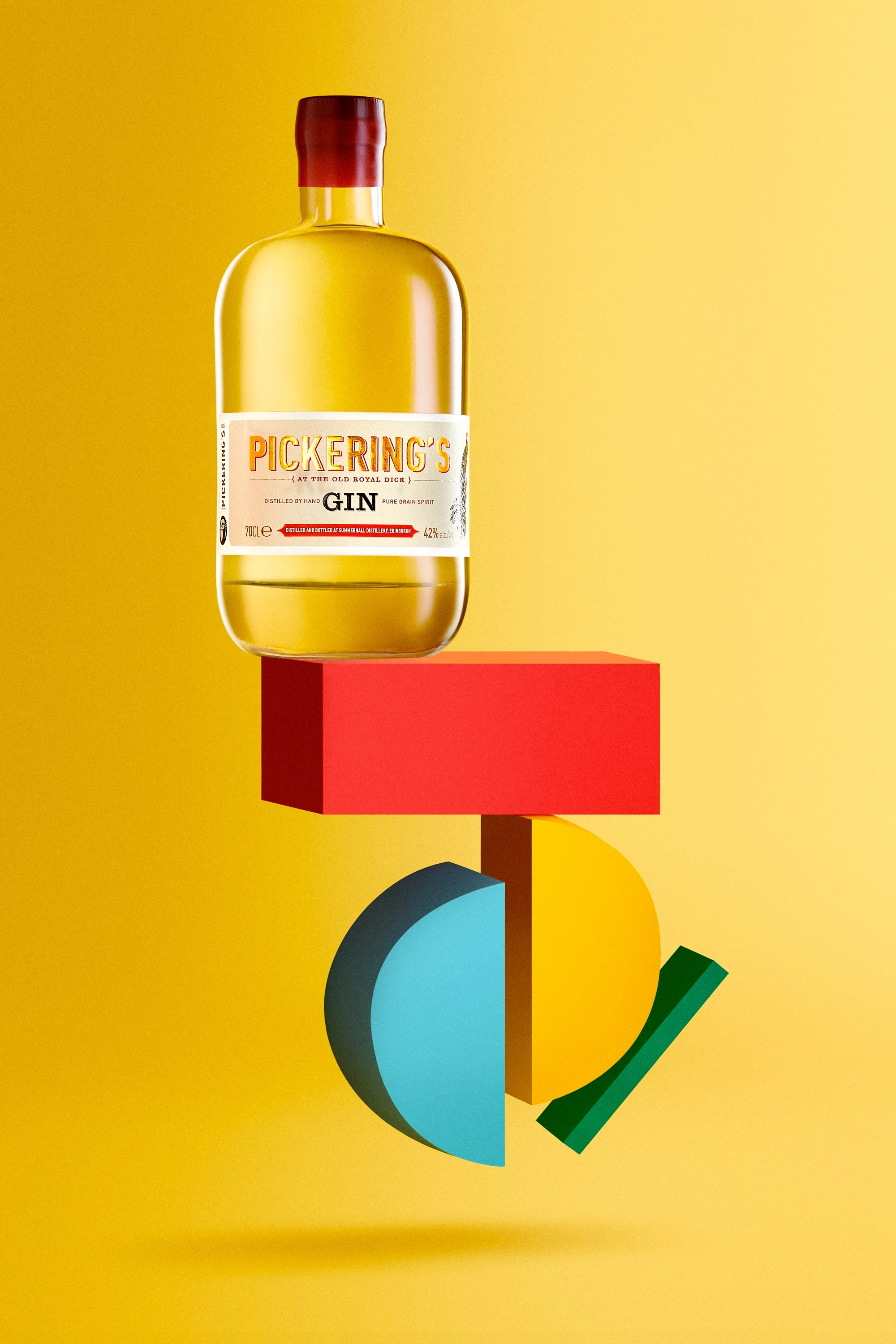 Bottle of Pickering's Gin with amber liquid, placed above colorful abstract geometric shapes on a yellow background.